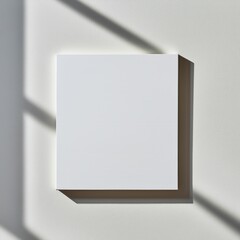 Wall Mural - blank white square canvas mockup against a white wall with window shadows.
