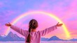 © Tuong - Rainbow After the Storm: Woman Standing with Arms Outstretched in Front of Beautiful Mountain Scenery