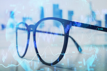 Canvas Print - Financial trading concept with glasses and data visualization on abstract digital background.