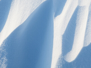 Wall Mural - snow texture. wind sculpted patterns on snow surface. wind in the tundra and in the mountains on the