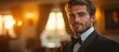© Cyber Shutter - Elegant best man in formal attire ready for a wedding celebration with warm sunset lighting in the background.