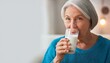 © photostockatinat - Senior Woman Enjoying a Glass of Milk