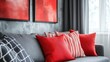 © MetaPixel - Cozy living room with soft red pillows on grey sofa and vibrant wall art creating a warm and inviting atmosphere for relaxation.