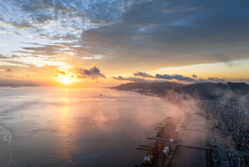 Aufkleber - Aerial view of container port and seaside natural scenery at sunrise