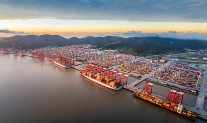 Aufkleber - Aerial view of container port and seaside natural scenery at sunrise