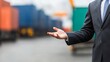 © pornthip - Businessman Presenting  Open Hand Gesture  Logistics  Shipping  Import  Export