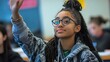 © gayuh - Young Woman Raises Hand In Class Asking Question