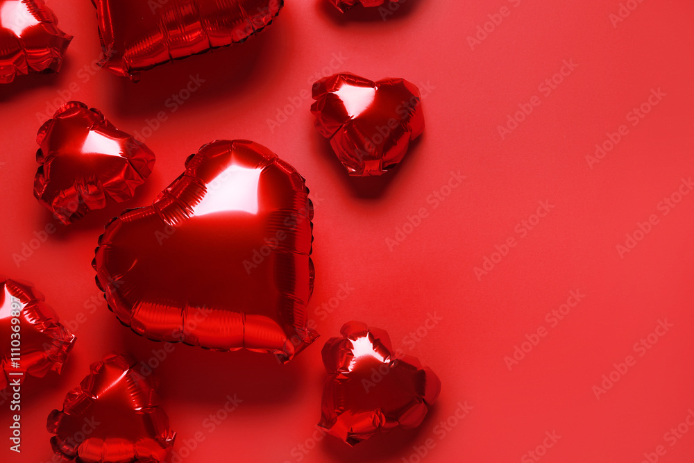 Heart shaped air balloons on red background