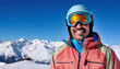 © Matthias - Cheerful South American man enjoying a sunny day of skiing with mountains in the background wearing reflective ski goggles and a bright jacket