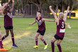 © Austockphoto - children on a football team celebrating
