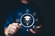 © Supatman - E-learning and online education technology concept. A person holds magnifying glass icons of e-learning, graduation cap, lightbulb, innovation, digital education, online learning, studying on Internet