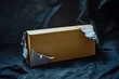 © john - Torn paper box with word coming soon in low light