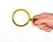 © Dmitry - Male Hand holding magnifying glass, loupe isolated on white background. Search information, research and analysis concept. close-up