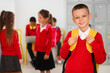 © Pixel-Shot - Little schoolboy with backpack at school hall