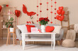 © Pixel-Shot - Engagement ring and and red roses on table in interior of living room decorated for Valentine's Day