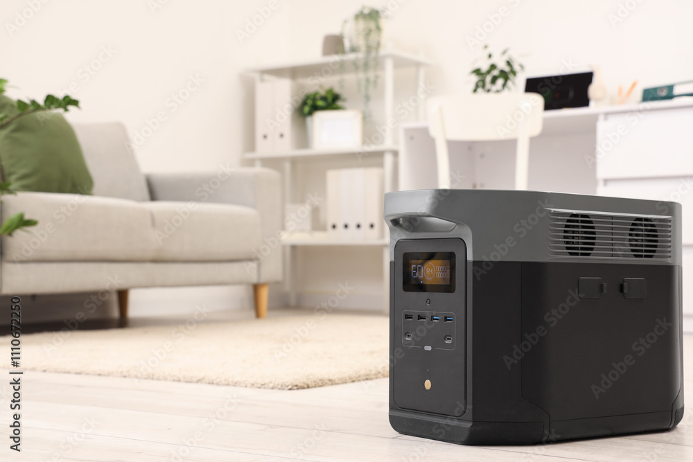 Portable power station on floor in office