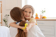 © Pixel-Shot - Little girl after chemotherapy with yellow ribbon hugging doctor in clinic. Childhood cancer awareness concept