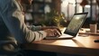 © Global Stock - A photo of a person typing on a keyboard in an office