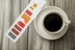 © Shahrimi - Coffee Break with a Bar Graph Showing a Slight Decline in Sales
