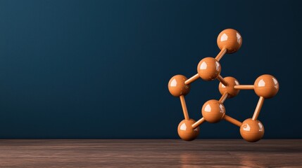 Aufkleber - A 3D molecular model with orange spheres connected by rods on a wooden surface against a dark blue background.