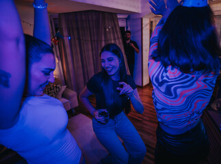 Poster - A vibrant group of friends celebrating a birthday in a cozy living room. The atmosphere is lively, with laughter and dance filling the space, creating a joyful and festive mood.