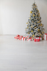 Wall Mural - Christmas tree with gifts, toys, garlands, white interior for the new year