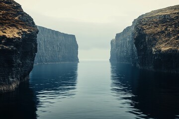 Sticker - Dark cliffs frame calm water passage.