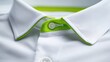 © pinporn manosri - Close-Up View of White Shirt Collar with Green Accent in Focus