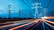 © Anjaasss - Power lines and vibrant light trails at night cityscape showcasing energy infrastructure and transportation. Urban technology concept