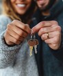 © Yuliya - happy couple holding house keys in new home cozy indoor scene lifestyle photography