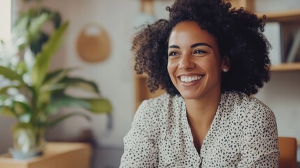 Wall Mural - Smiling woman with curly hair working in office environment