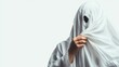 © Osc AI - Person in a ghostly costume holding fabric, isolated on white background.