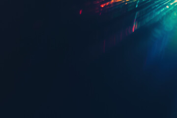 Poster - Dark abstract background with colorful light beams. Futuristic design, modern art, space for text.