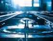 © Ranta Images - Dynamic movement featuring a water droplet in an industrial zone, captured with backlight