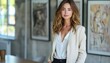 © Saad - relaxed business woman standing with hands in her pockets