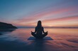 © Thedinindu - Woman meditates on a tranquil beach at sunset  finding peace and serenity in nature.