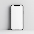 © Mark - A blank smartphone rests against a wall, set for customization or display.