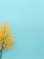 vibrant yellow tree against a soft blue background