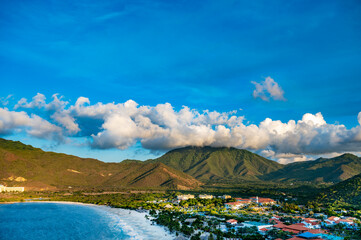 Wall Mural - A beautiful beach with a large body of water and a lot of boats