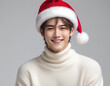 © anmitsu - Portrait of a young handsome male model wearing a Santa Claus hat and a turtleneck sweater. Christmas image.サンタクロースの帽子をかぶってタートルネックのセーターを着た若いイケメン男性モデルのポートレート。クリスマスのイメージ。