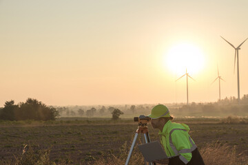 Fototapete - Survey Team Alternative energy for future. Engineers survey and checking wind turbines in sunset. Wind Turbine Renewable energy technology and sustainability.