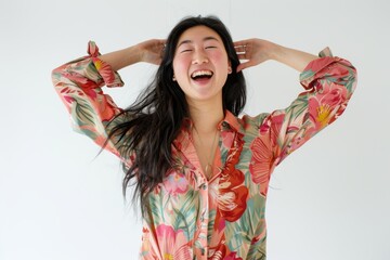 Wall Mural - Portrait of a joyful asian woman in her 20s sporting a vented fishing shirt in front of white background