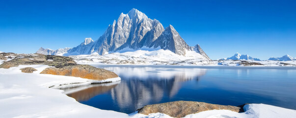 Wall Mural - scenic winter landscape: pristine blue lake and snow-covered mountains in greenland creating a seren