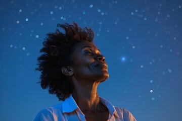 Poster - Portrait of a blissful afro-american woman in her 40s wearing a simple cotton shirt on sparkling night sky