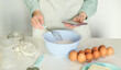 © Pawel - Person baking using mobile app for finding the recipe