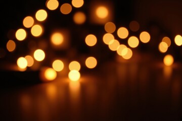 Wall Mural - warm glowing bokeh lights on dark background creating cozy atmosphere.