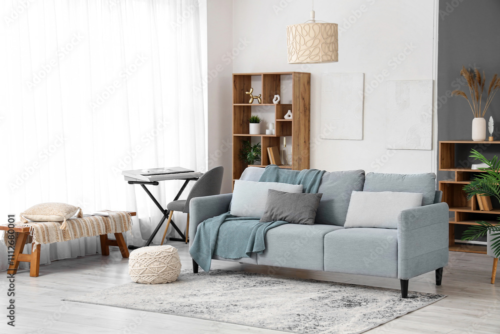 Interior of living room with sofa, synthesizer and bench