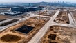© DigitalArt - Aerial view of an expansive construction site featuring bare land, machinery, and structures under development in an urban environment.