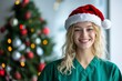 © Giorgi - Woman smiling in festive Santa hat during holidays