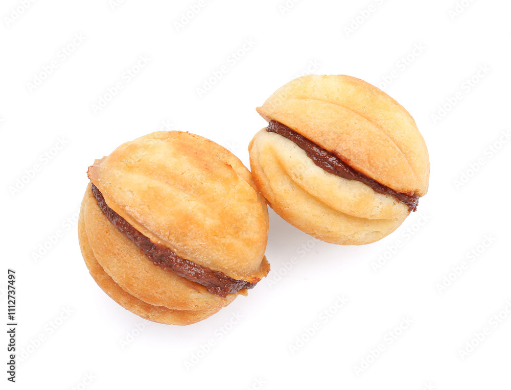 Sweet walnut shaped cookies with boiled condensed milk on white background